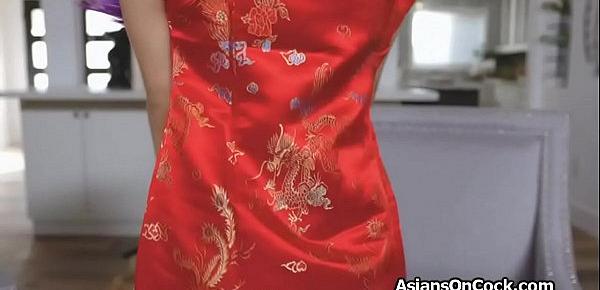  Asian hottie in red cheongsam riding a fat cock